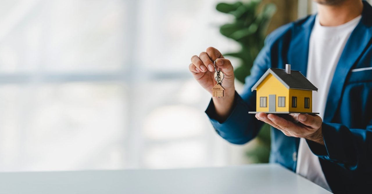 Mortgage adviser discussing a self-build mortgage with clients