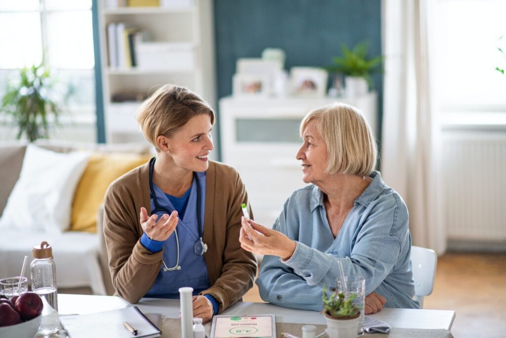 caregiver or healthcare worker with senior woman